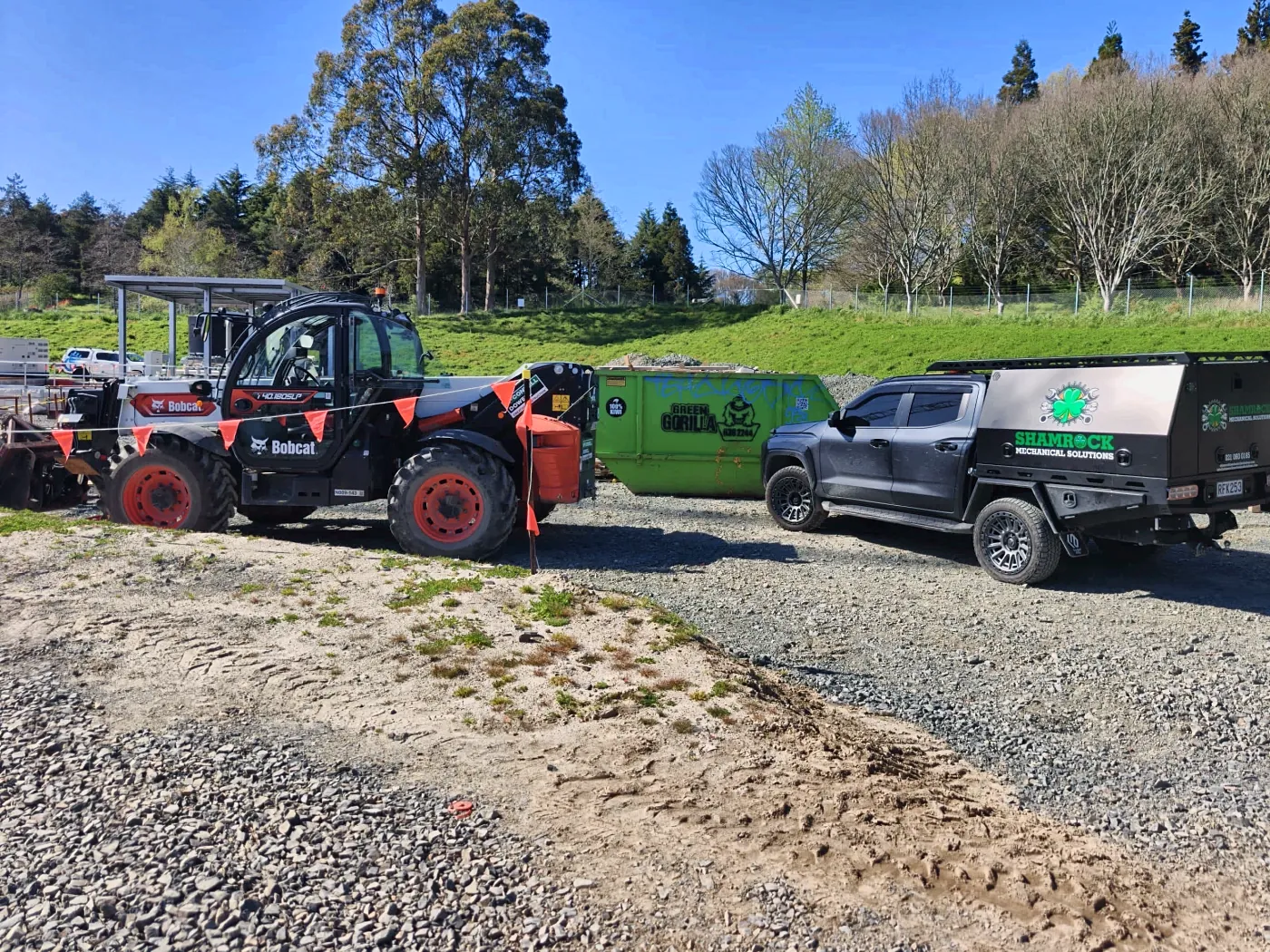 Telehandler and plant on a build site with the service truck