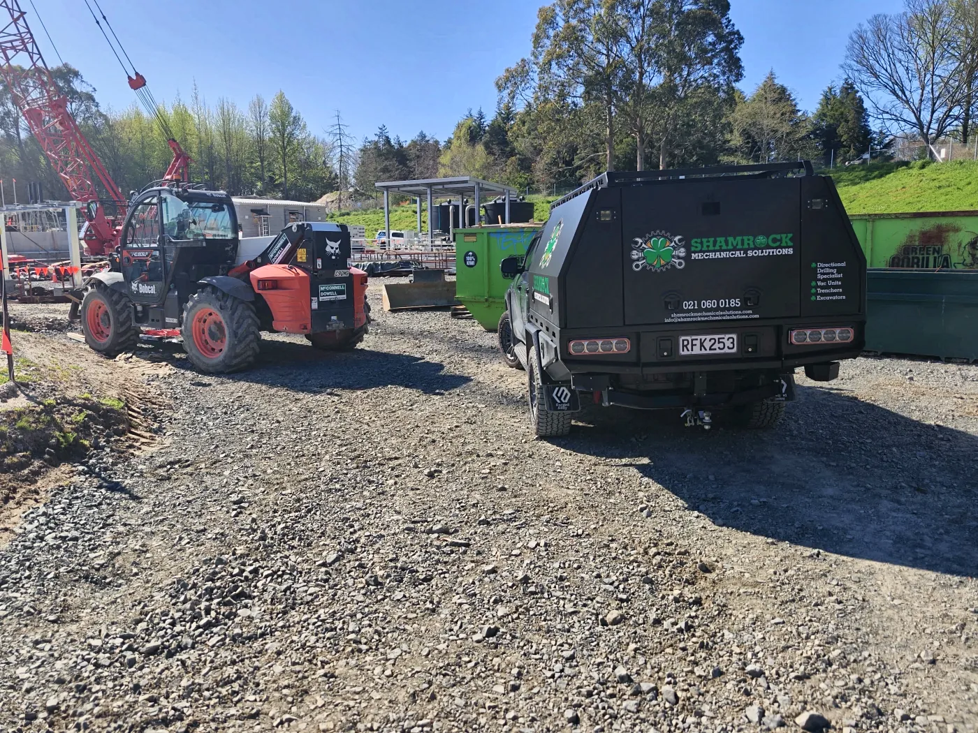 Service truck parked next to a crane